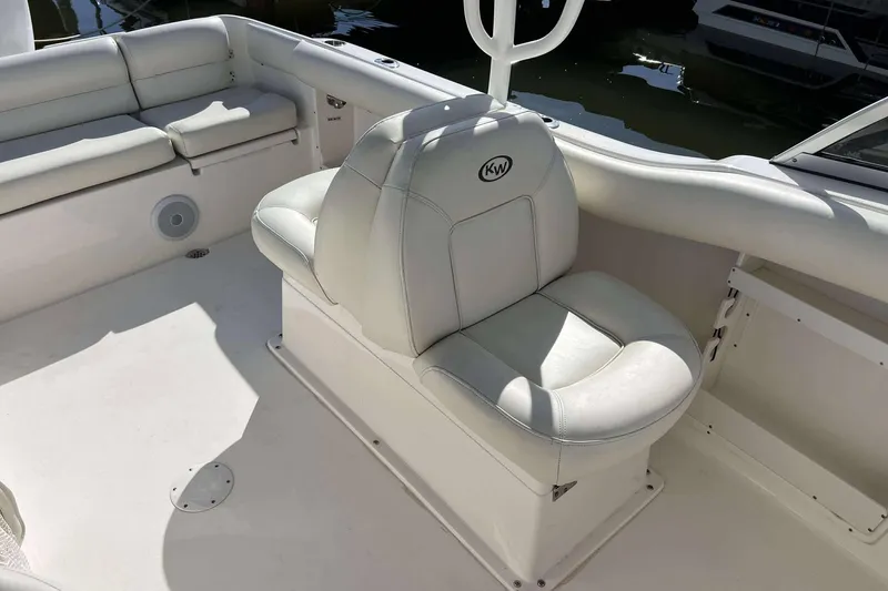 Slide: The Image of 2020 Key West 239 DFS boat interior with white cushioned seating. - 10