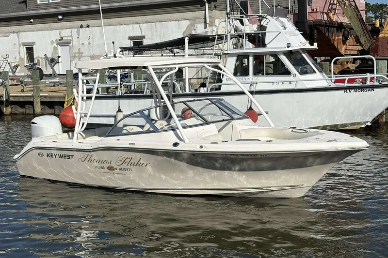 Slide: The Image of 2020 Key West 239 DFS boat docked in a marina, sunny day. - 17
