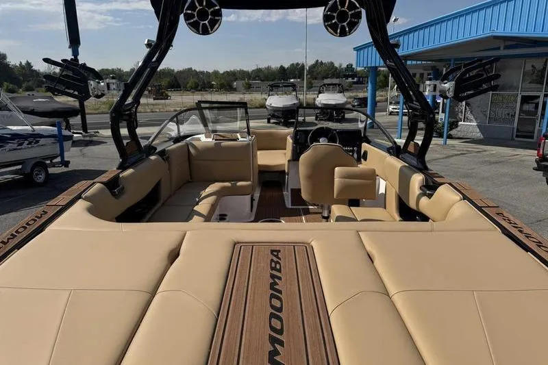 Slide: The Image of 2023 Moomba Max boat interior with tan seating and modern design. - 7