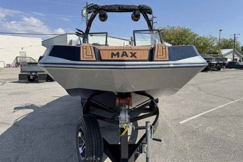 Slide: The Image of 2023 Moomba Max boat on trailer in parking lot, front view. - 8