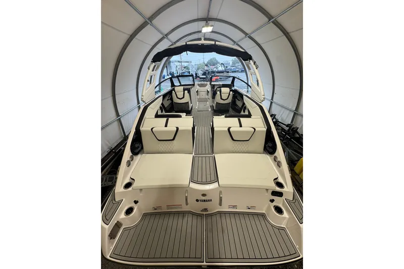 Slide: The Image of 2026 Yamaha Boats 222SD interior with white cushioned seating and sleek design. - 10