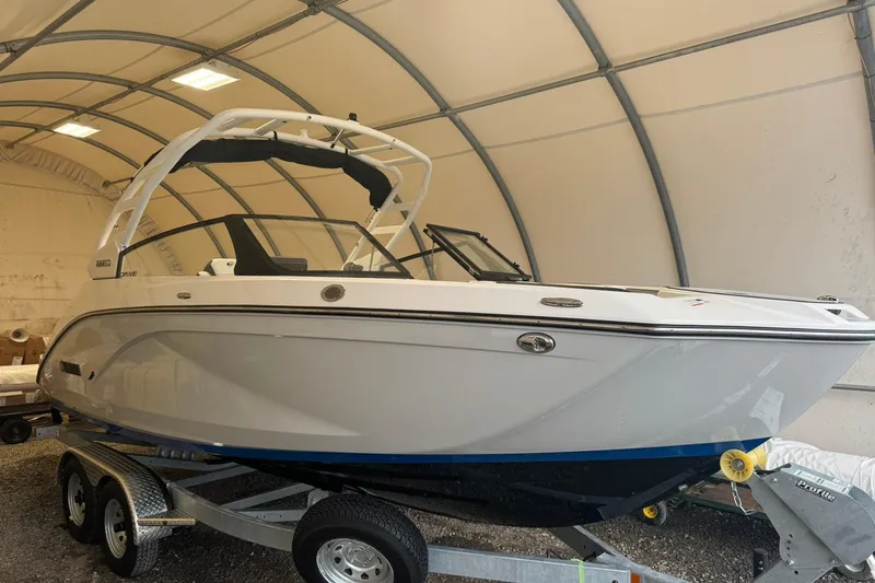 Slide: The Image of 2026 Yamaha Boats 222SD on trailer in covered storage area. - 2