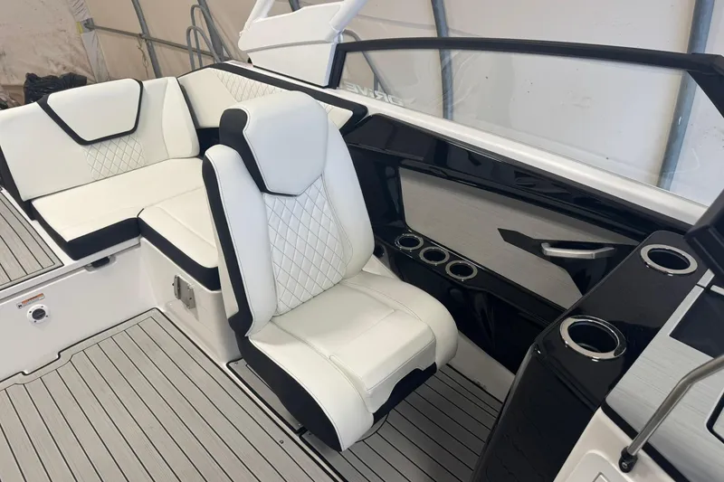 Slide: The Image of 2026 Yamaha Boats 222SD, sleek design, spacious seating, stored in a covered area. - 5