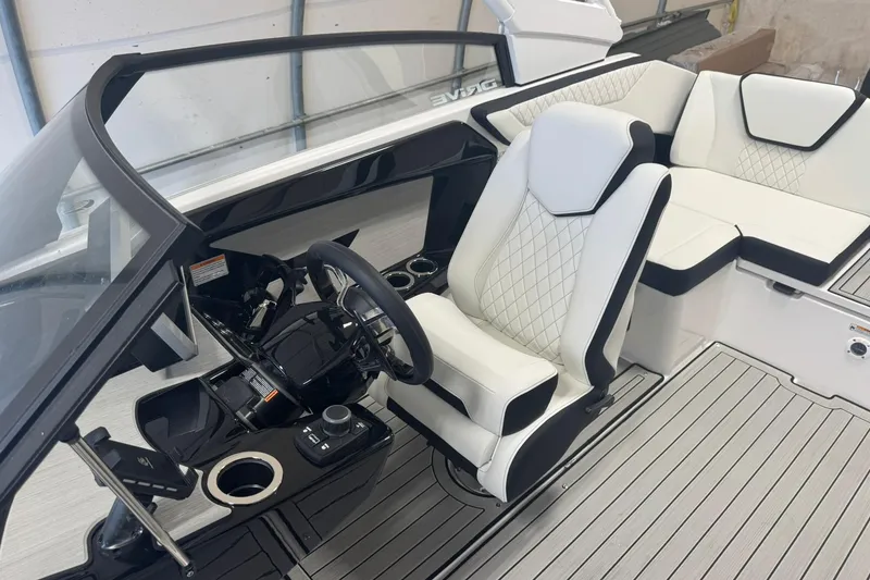 Slide: The Image of 2026 Yamaha Boats 222SD interior with white and black seating, cup holders, and sleek design. - 6