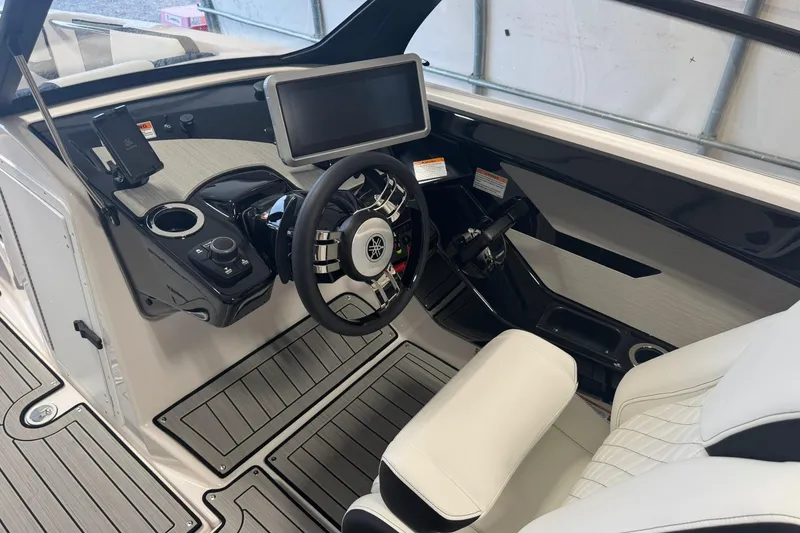 Slide: The Image of 2026 Yamaha Boats 222SD interior with sleek steering and luxurious seating. - 7