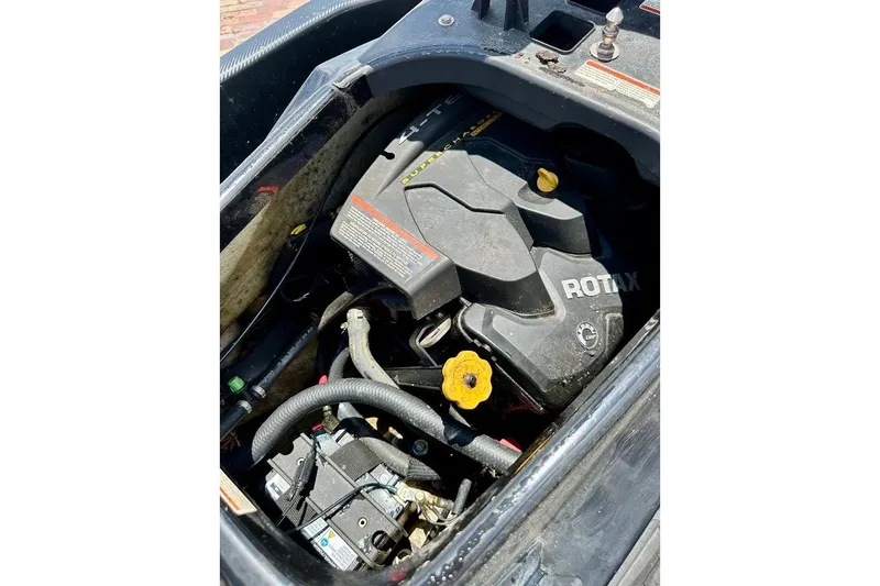 Slide: The Image of 2006 Sea-Doo RXT engine compartment with visible Rotax engine components. - 11