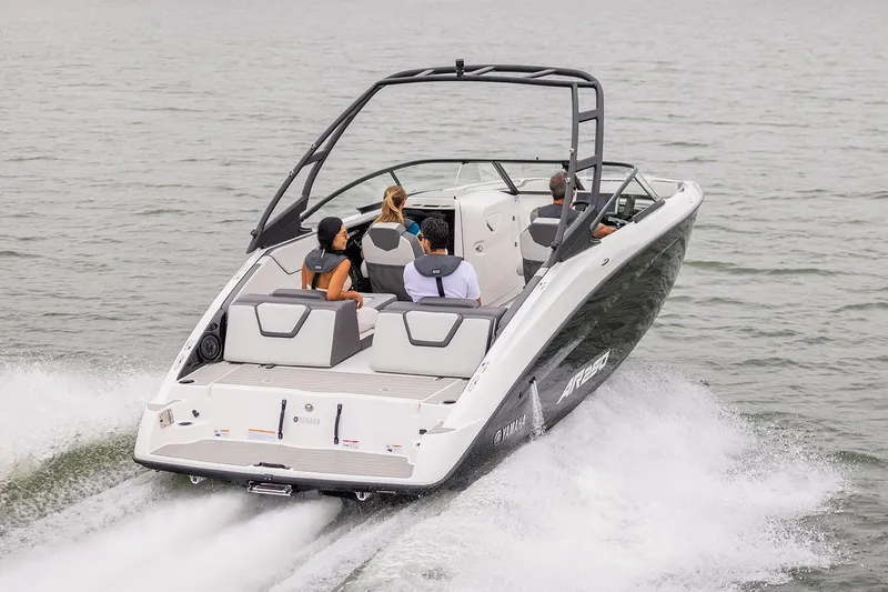 Slide: The Image of Manufacturer Provided Image: 2026 Yamaha Boats AR250 cruising on a lake with passengers enjoying the ride. - 2