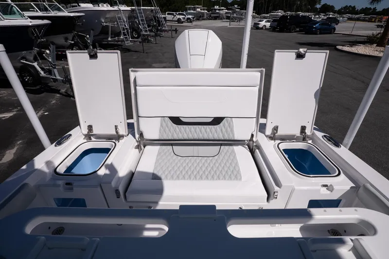 Slide: The Image of 2026 Blackfin 242 HB boat interior with seating and storage compartments. - 14