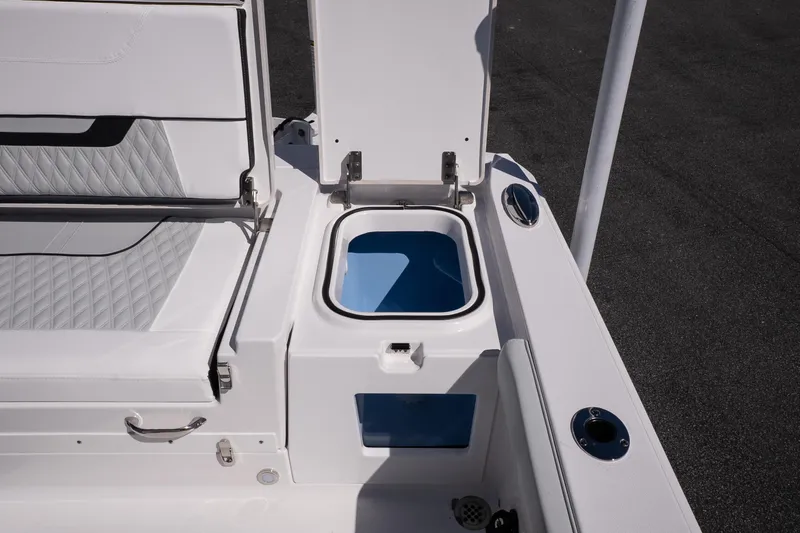 Slide: The Image of 2026 Blackfin 242 HB boat interior with open storage compartment and seating. - 15
