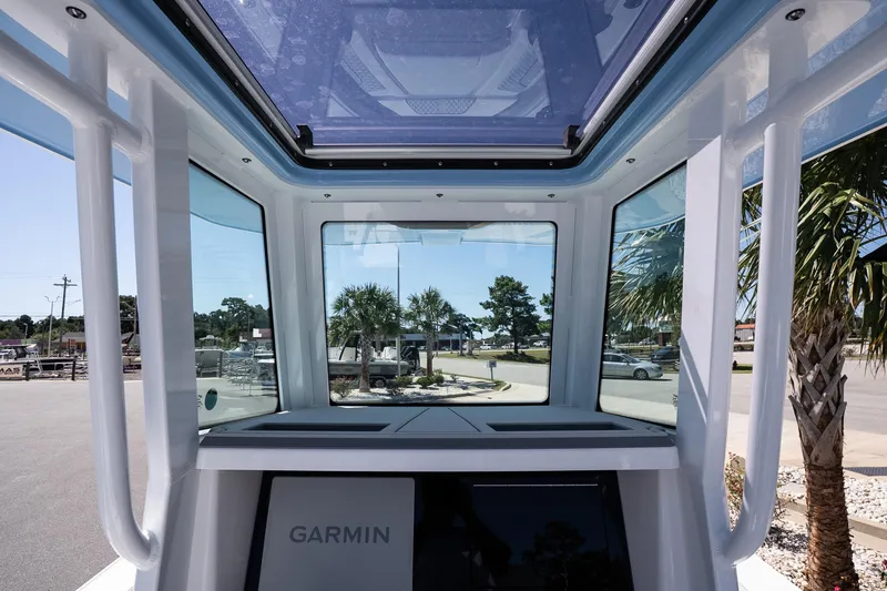 Slide: The Image of Interior view of 2026 Blackfin 242 HB boat with Garmin navigation system. - 18