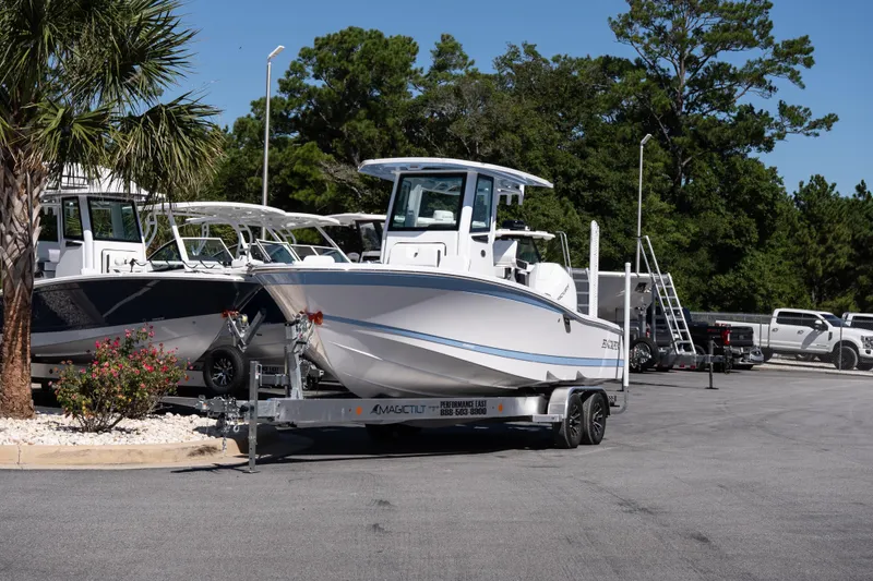 Slide: The Image of 2026 Blackfin 242 HB boat on trailer in outdoor dealership setting. - 3