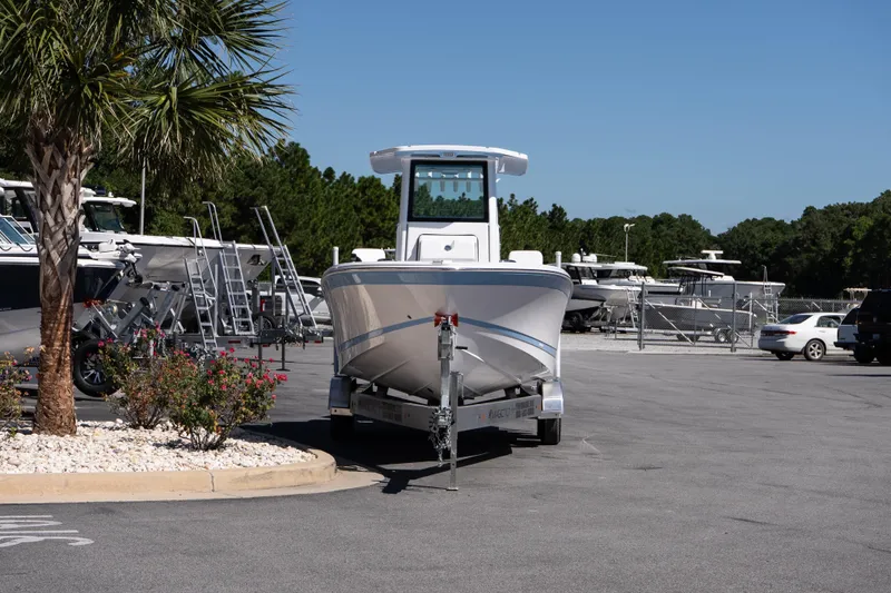 Slide: The Image of 2026 Blackfin 242 HB boat on trailer in parking lot with palm tree. - 4