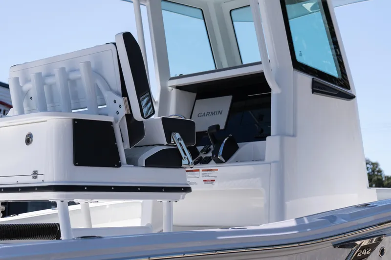 Slide: The Image of 2026 Blackfin 242 HB boat interior with Garmin navigation system and seating. - 7