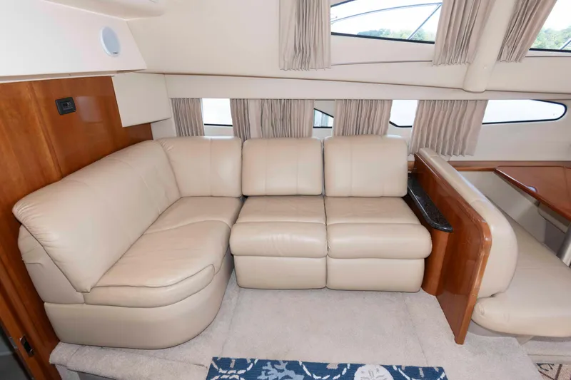Slide: The Image of Luxurious interior of 2005 Carver 41 Cockpit Motor Yacht with beige leather seating. - 14