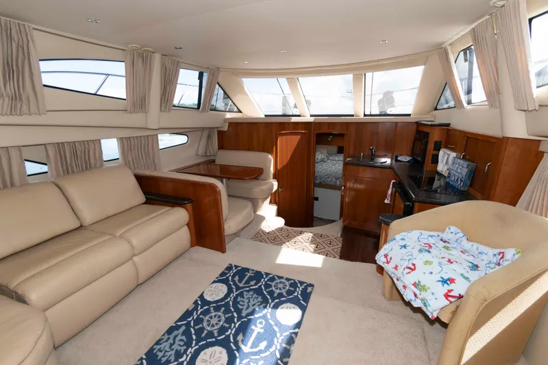 Slide: The Image of Luxurious interior of 2005 Carver 41 Cockpit Motor Yacht with plush seating and modern amenities. - 13