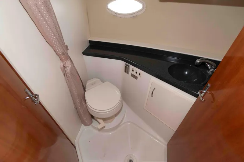 Slide: The Image of Bathroom interior of 2005 Carver 41 Cockpit Motor Yacht with toilet and sink. - 24