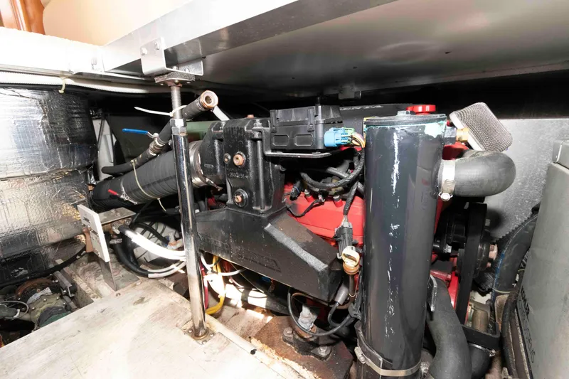Slide: The Image of Engine room of 2005 Carver 41 Cockpit Motor Yacht, showcasing mechanical components. - 27