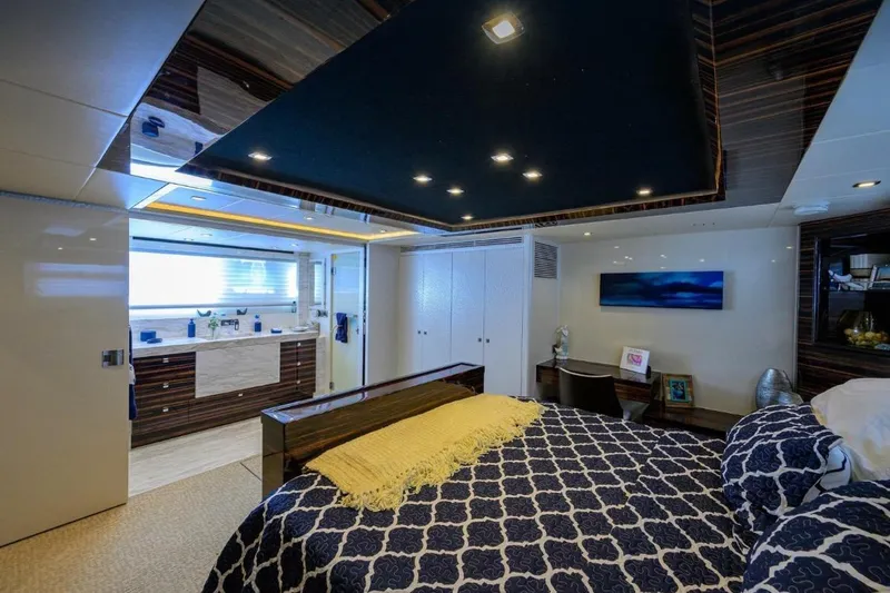 Slide: The Image of Luxurious 2014 Hampton Fly yacht bedroom with modern decor and elegant furnishings. - 17