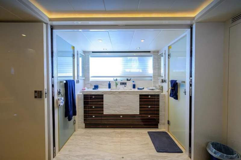 Slide: The Image of Luxurious yacht bathroom with modern fixtures, marble accents, and ambient lighting, Hampton Fly 2014 model. - 19