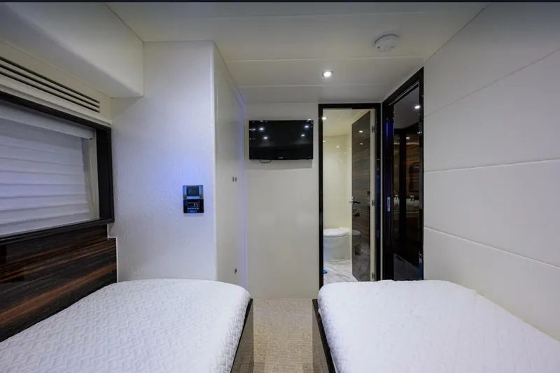 Slide: The Image of Interior of 2014 Hampton Fly yacht with twin beds and modern decor. - 23