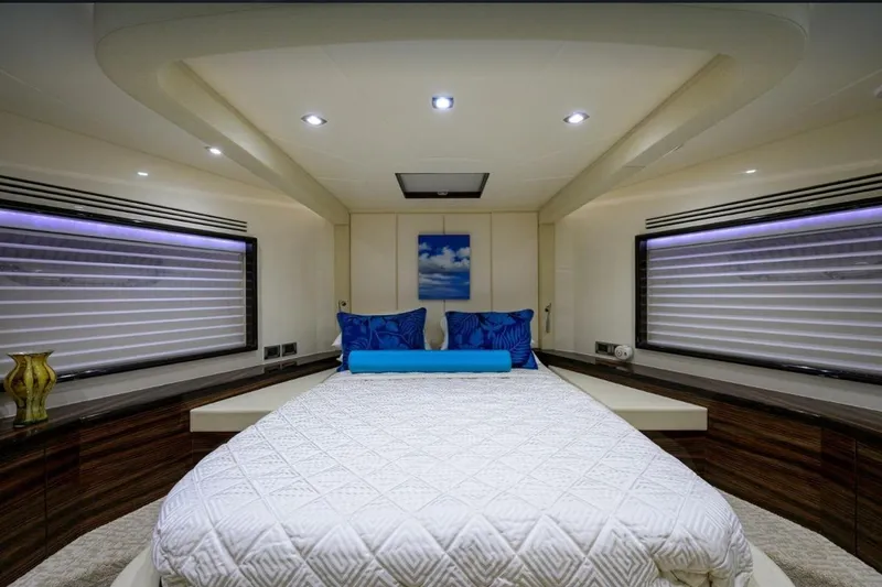 Slide: The Image of Luxurious 2014 Hampton Fly yacht bedroom with modern decor and ambient lighting. - 24