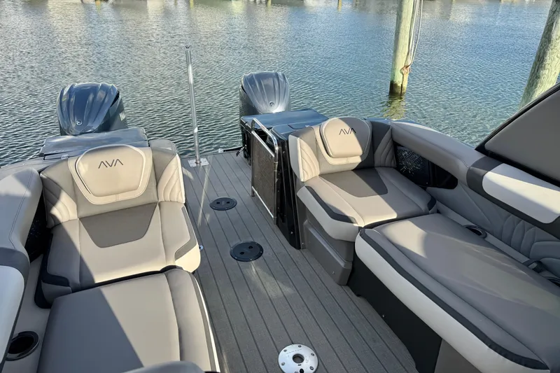Slide: The Image of 2025 Avalon Excalibur Quad Lounge Windshield boat interior with plush seating and dual engines. - 38