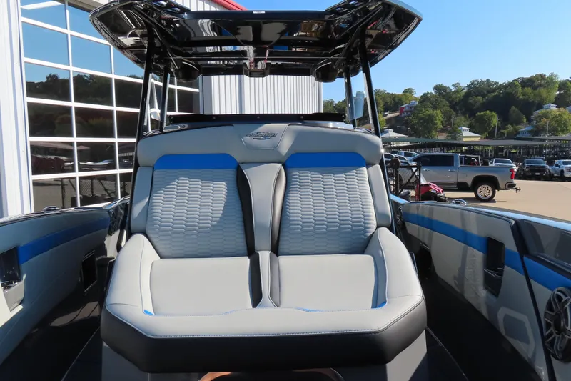Slide: The Image of 2026 Sunsation 32 CCX boat with modern seating and sleek design. - 11