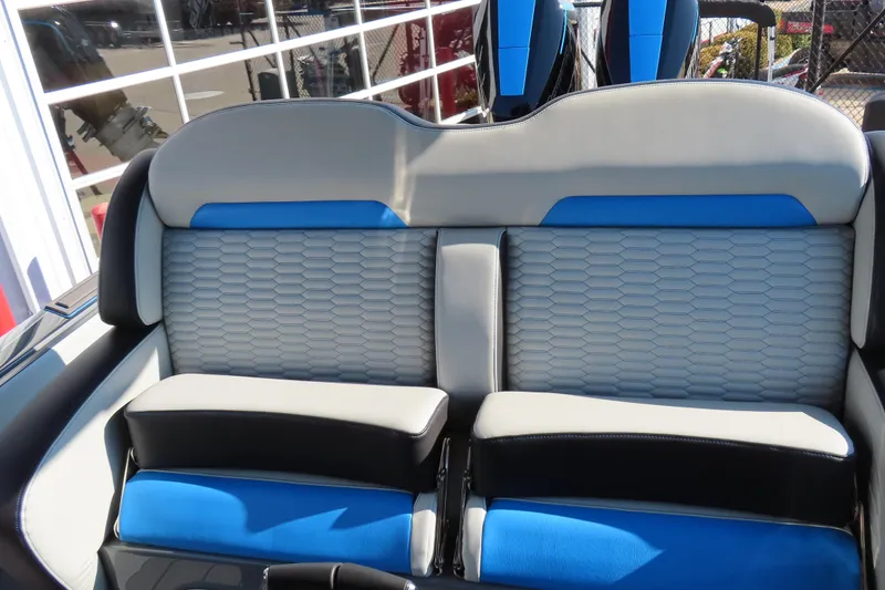 Slide: The Image of 2026 Sunsation 32 CCX boat interior with blue and gray seating design. - 12