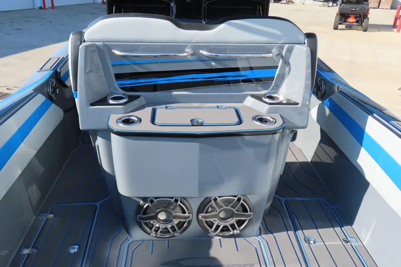 Slide: The Image of 2026 Sunsation 32 CCX boat interior with sleek design, featuring speakers and cup holders. - 14