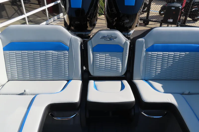 Slide: The Image of 2026 Sunsation 32 CCX boat seating with blue and gray upholstery, showcasing modern design. - 16