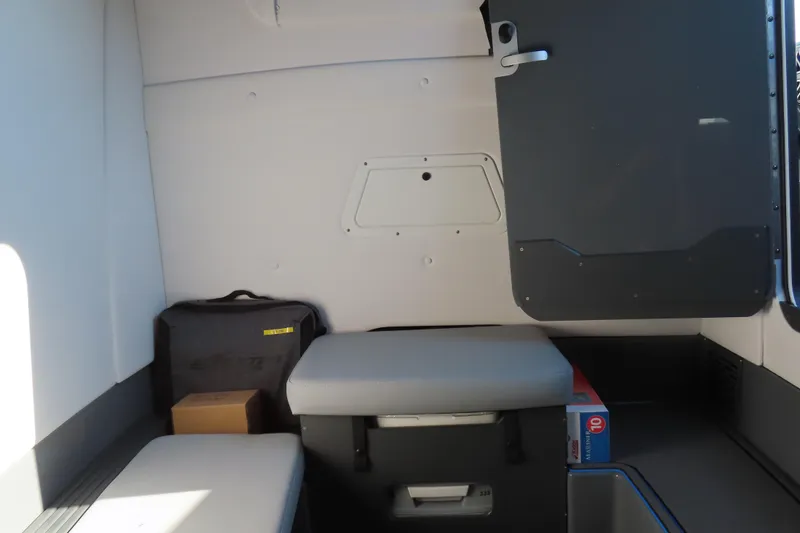 Slide: The Image of Interior cabin of 2026 Sunsation 32 CCX boat, featuring seating and storage. - 18