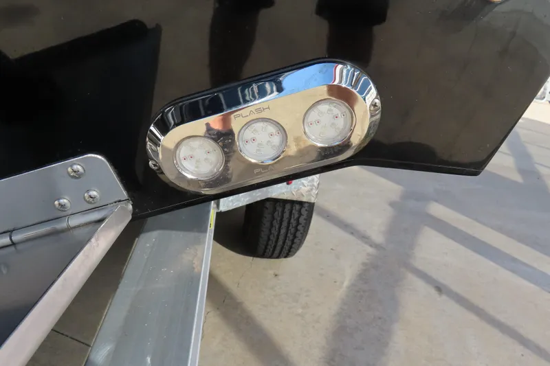 Slide: The Image of Close-up of 2026 Sunsation 32 CCX boat's rear light panel on a trailer. - 21