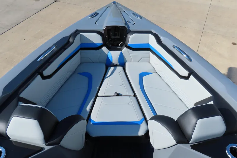 Slide: The Image of 2026 Sunsation 32 CCX boat interior with modern seating and blue accents. - 9