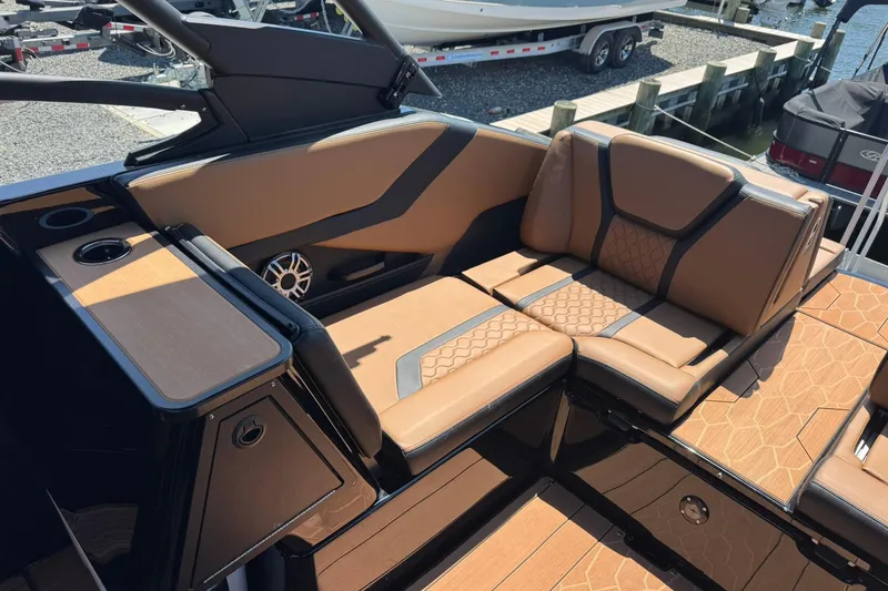 Slide: The Image of 2026 Yamaha Boats 255XD interior with luxurious tan seating and modern design. - 12