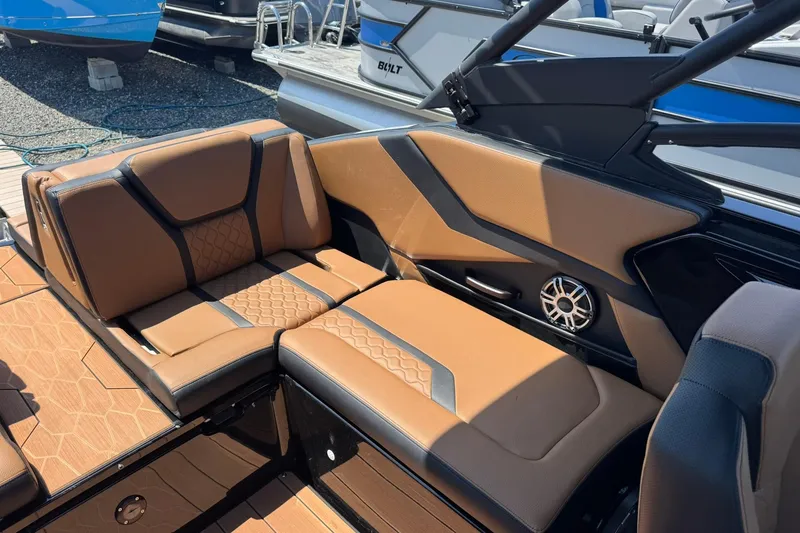 Slide: The Image of Luxurious seating on 2026 Yamaha Boats 255XD, featuring tan upholstery and sleek design. - 13