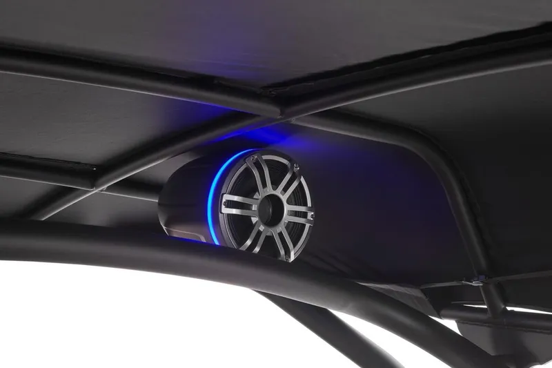 Slide: The Image of 2026 Yamaha Boats 255XD speaker with blue LED lighting under canopy. - 15