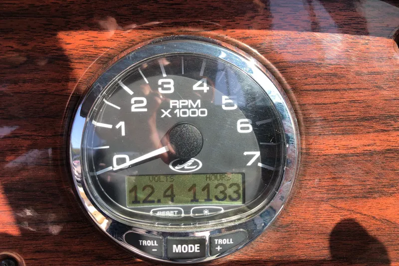 Slide: The Image of Tachometer of 2007 Sea Ray 220 Sundeck showing RPM and voltage readings. - 13