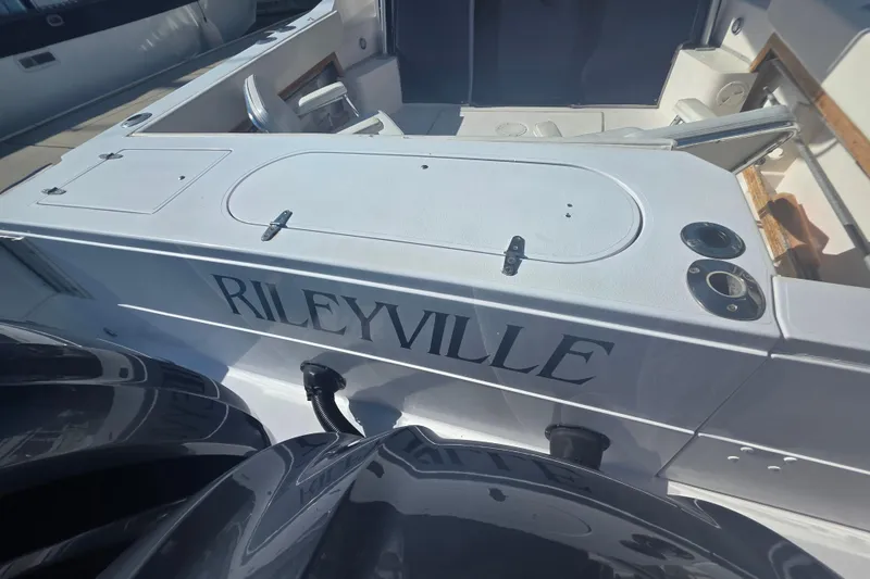 Slide: The Image of 1990 Grady-White Marlin 280 boat deck with "RILEYVILLE" name displayed. - 11