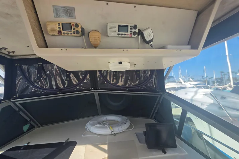 Slide: The Image of 1990 Grady-White Marlin 280 boat interior with navigation equipment and life preserver. - 20
