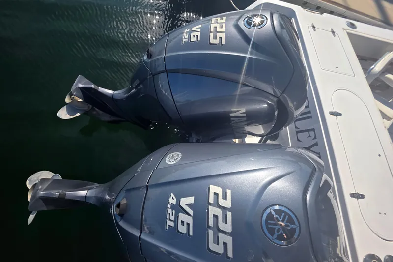 Slide: The Image of Twin Yamaha 225 V6 outboard engines on a 1990 Grady-White Marlin 280 boat. - 9