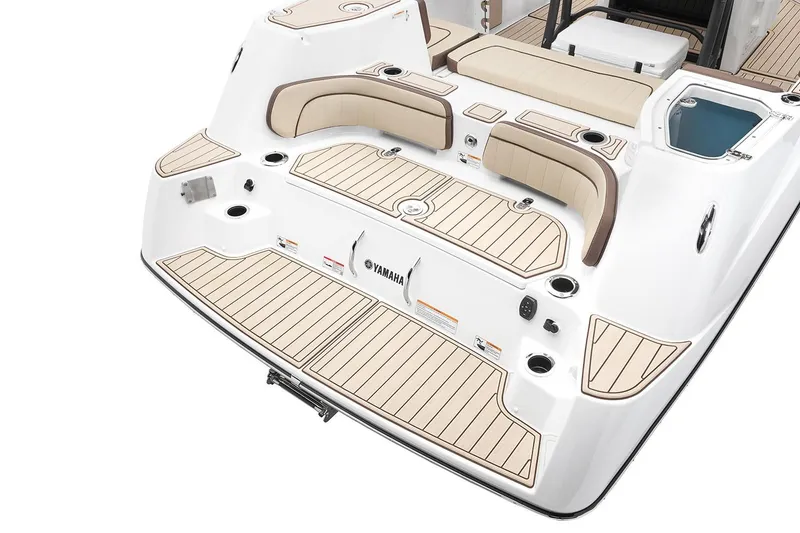 Slide: The Image of Manufacturer Provided Image: 2026 Yamaha Boats 255 FSH Sport H interior with beige seating and sleek design. - 25