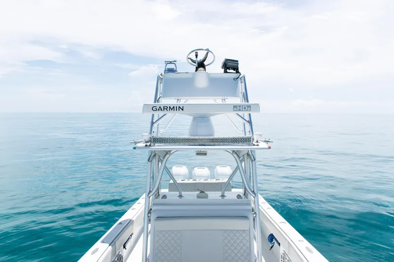 Slide: The Image of 2006 SeaVee 340B boat with Garmin equipment on calm ocean waters. - 11