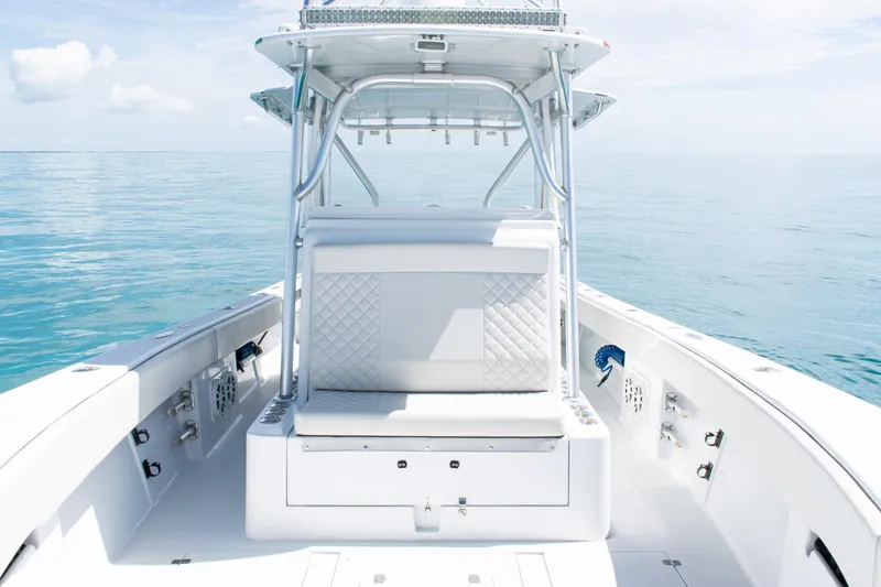 Slide: The Image of 2006 SeaVee 340B boat interior with white seating, open ocean view. - 12