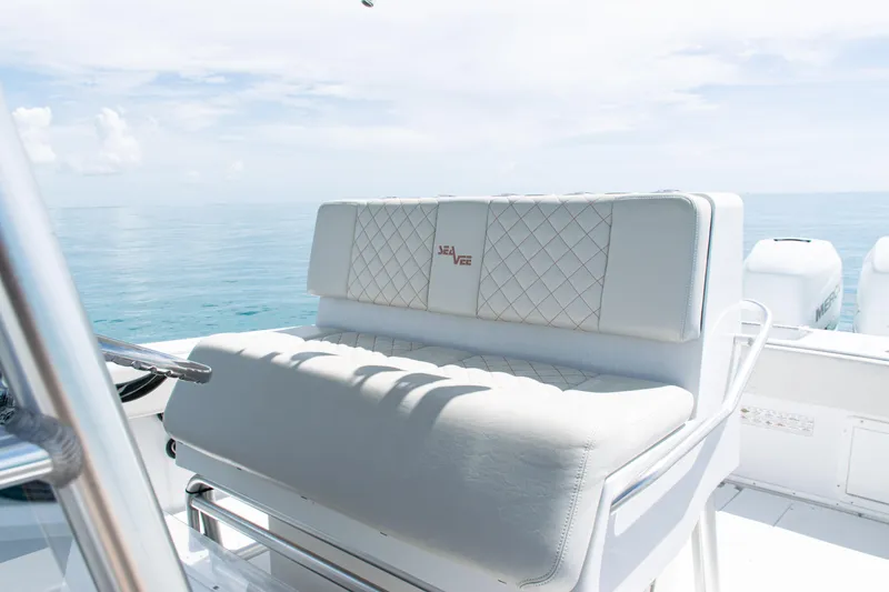 Slide: The Image of 2006 SeaVee 340B boat with white seating, ocean view, and clear sky. - 19