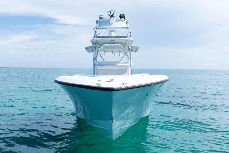 Slide: The Image of 2006 SeaVee 340B boat on clear blue ocean under a bright sky. - 2