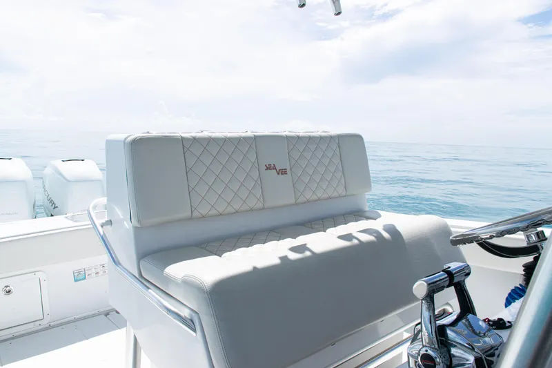Slide: The Image of 2006 SeaVee 340B boat interior with cushioned seating and ocean view. - 20