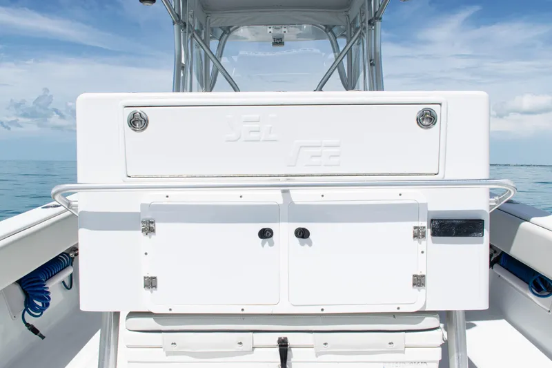 Slide: The Image of 2006 SeaVee 340B boat deck with storage compartments and ocean backdrop. - 33