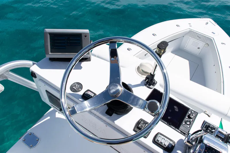 Slide: The Image of Steering console of a 2006 SeaVee 340B boat with clear ocean view. - 34