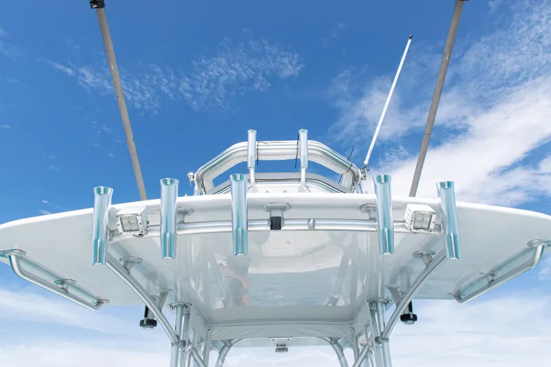 Slide: The Image of 2006 SeaVee 340B boat with rod holders against a clear blue sky. - 36