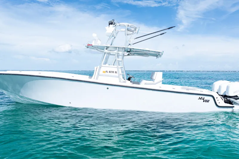 Slide: The Image of 2006 SeaVee 340B boat on clear ocean water under a blue sky. - 4